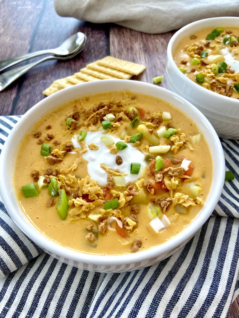 vegan potato soup with toppings and crackers